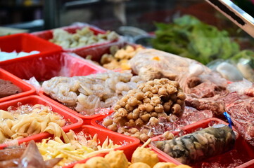 A close-up of a fresh squid mouth, aka dragon ball, at a stir-fry stall in Nanjichang Night Market. Squid mouth is a unique seafood delicacy that can be cooked such as deep-fried or salt and pepper.