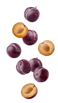 Falling plum isolated on white background, full depth of field