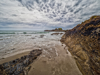 Sandy Castlefreke-Warren Bay Beach with Waves Rolling In