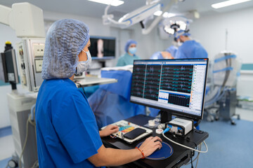 Surgery specialist working with modern equipment. Operating professional technologies.