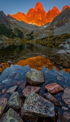 High tatra lake autumn mountain glow with pine forest reflection in serene natural setting