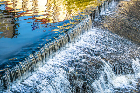 An artificial waterfall on rocky rapids.