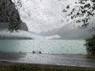 Zelfklevend Fotobehang View from inside a motorhome camper on a rainy day in the Briksdal Glacier Valley, Norway. © Alberto Gonzalez 