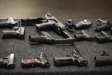 Pistols in a shooting range close-up.