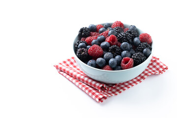 Fresh assortment berries in bowl isolated on white background. Copy space
