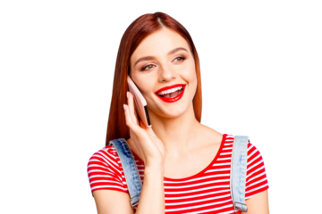 Portrait of nice vivid girlish red straight-haired excited happy smiling young girl with opened mouth talking on the phone, isolated over blue background