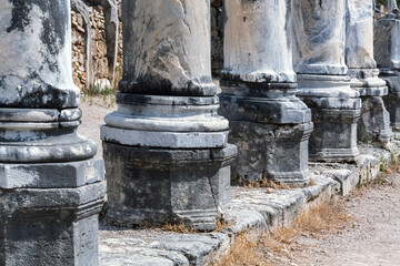 Column octogonal bases in Perge. Close-up of classical colonnade in ancient Greek and Roman city....