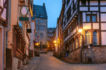 Night medieval street with traditional half-timbered houses, Marburg an der Lahn, Hesse, Germany - 761333495