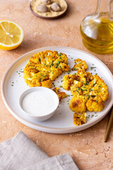 Cauliflower steaks with white sauce. Healthy eating. Vegetarian food.