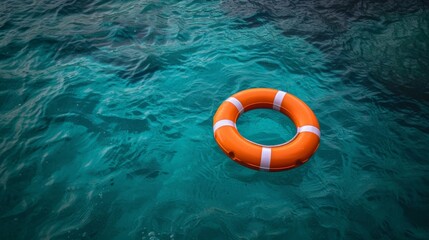 Orange Life Preserver Drifting in the Clear Blue Ocean Under a Sunny Sky with Lush Green Water
