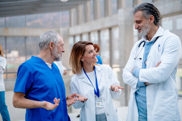 Group of doctors talking during conference. Medical networking. Medical experts attending an...