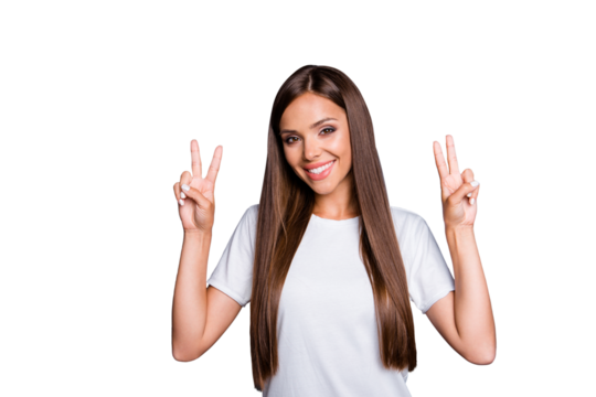 Portrait of brown-haired gorgeous attractive nice smiling young lady with long hair over grey background, showing double v-sign gesture, isolated