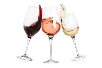 Different types of wine splashing in glasses on white background
