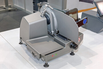 Deli Meat Slicer Machine at Counter Top in Butcher Shop