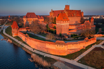 Malbork castle over the Nogat river at sunset, Poland - 761345614