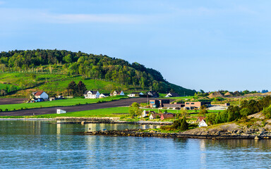 Fototapeta na wymiar Village over FjordSailing, Stavanger, Boknafjorden, Norway, Europe