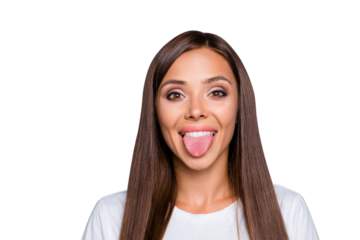 Close up portrait of funny young woman showing tongue and looking at the camera isolated on gray background