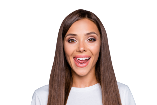 Close up portrait of young attractive woman with long brunette hair seductively licking her lips and look at the camera isolated on gray background