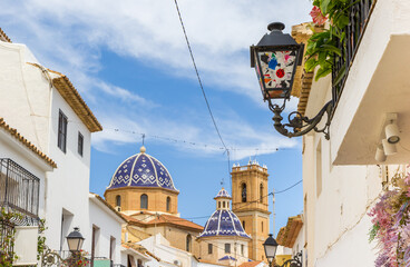 Decorated street light in front of the cathedral in Altea, Spain - obrazy, fototapety, plakaty