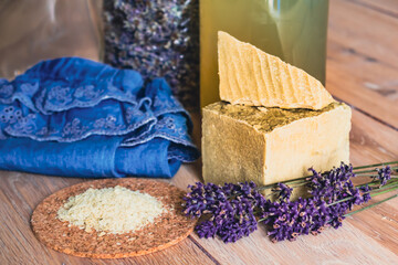 Bottles of homemade laundry on a table with lavender, Marseille grated soap, DIY, do it yourself,...