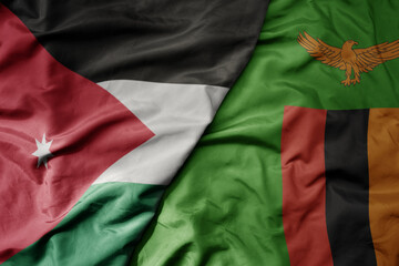 big waving national colorful flag of zambia and national flag of jordan.