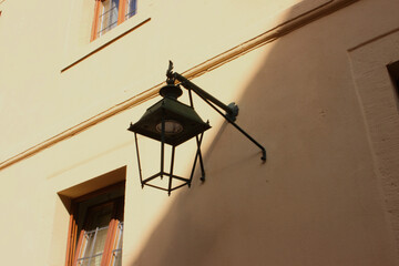 Picture of a yard lantern hanging on the wall.