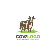 Full-color cow logo on a grass patch