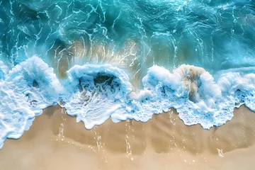 Fototapeten A drone shot of blue color sea waves hitting velvety soft sands , top view. © Heals on wheels