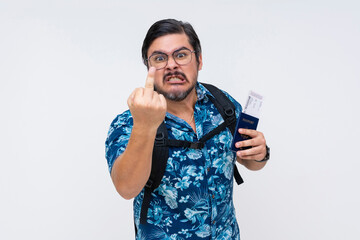 Middle-aged male tourist in a floral shirt expressing anger with a rude gesture, flipping the bird...