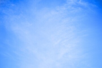 Obraz premium clear blue sky with light white clouds background