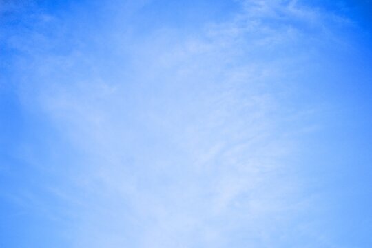clear blue sky with light white clouds background