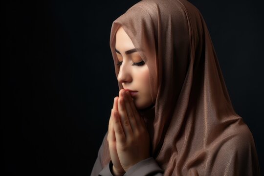 A woman in a headscarf prays with clasped hands. Fictional character created by Generated AI. 