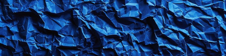 Captivating possibilities with a crumpled paper texture background in royal blue, invoking a sense of regality and grandeur.