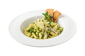 Penne pasta with pesto sauce, zucchini, green peas and basil. Penne pasta with pesto sauce, zucchini, green peas and basil.