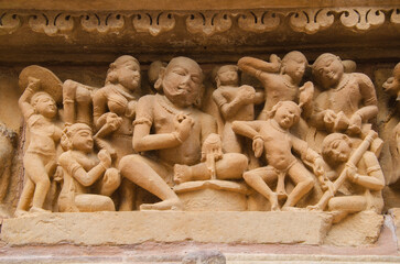 Beautiful stone carved sculptures on the outer wall of the temple, Khajuraho, Madhya Pradesh, India, Asia.