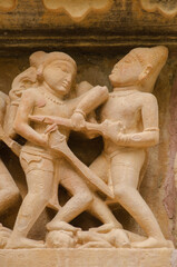 Beautiful stone carved sculptures on the outer wall of the temple, Khajuraho, Madhya Pradesh,...