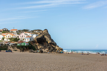 Atlantic Ocean, rocky cliffs and sandy beach in Portugal
