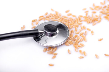 Top view on stethoscope checking up the grain. Grain crisis and wheat deficit concept - obrazy, fototapety, plakaty