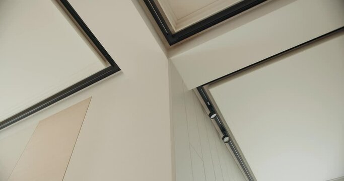 Suspended ceiling with installed lighting in apartment with modern interior. Contemporary decoration of house and illumination idea. Decorative trends in interior design