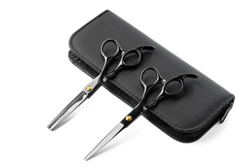 Hairdressing scissors with leather case on white background