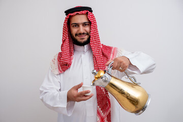 Arabian man holding arabic coffee pot wearing dishdasha and kandura on isolated white background with generosity and hospitality feelings