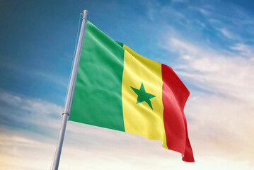 Waving flag of Senegal in blue sky. Senegal flag for independence day. The symbol of the state on wavy fabric.
