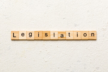 legislation word written on wood block. legislation text on table, concept