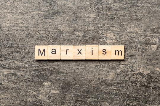 marxism word written on wood block. marxism text on table, concept