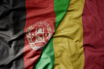 big waving national colorful flag of mali and national flag of afghanistan.