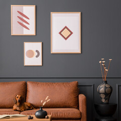 Interior design of living room interior with mock up poster frame, brown sofa, patterned rug, wooden coffee table, vase with dried flowers, dog and personal accessories. Home decor. Template.