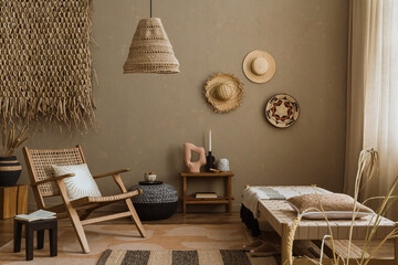 Interior design of ethno style living room with rattan furniture, daybed, pouf, hanging decoration...