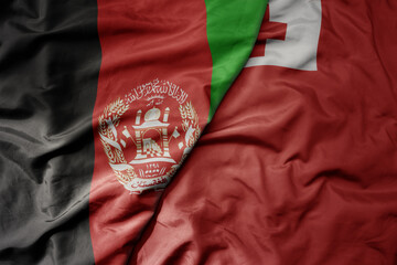 big waving national colorful flag of Tonga and national flag of afghanistan.