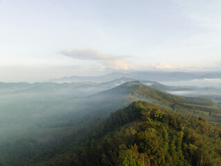 Aerial mountain peak sunrise tropical rainforest sky with cloud - 761468683
