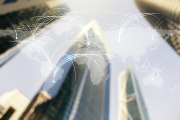 Double exposure of abstract digital world map hologram with connections on modern skyscrapers background, research and strategy concept